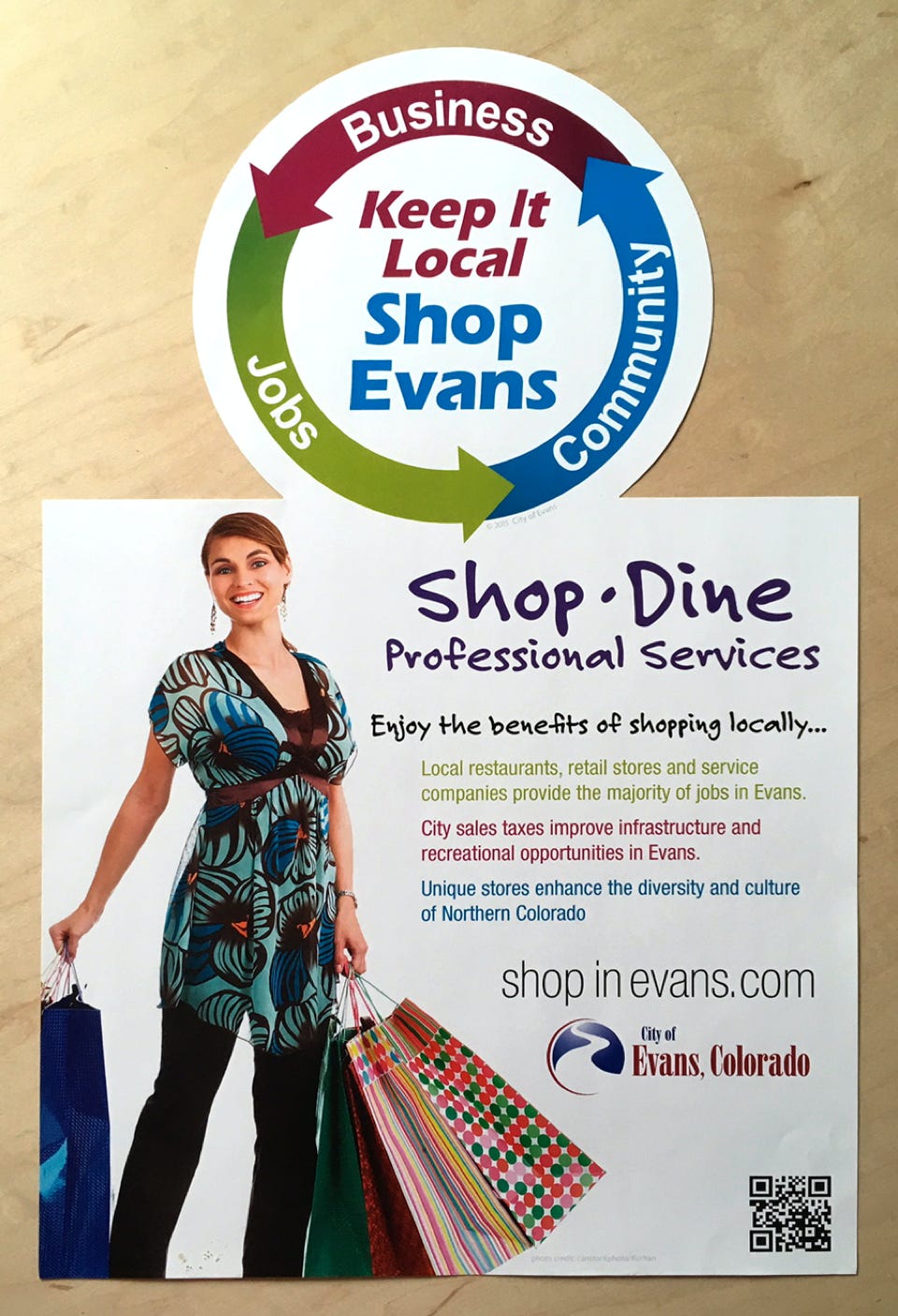 Poster reminding consumers to shop local. Die-cut. Commercial printing.